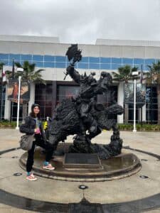 Hoffee posing with a World of Warcraft statue.
