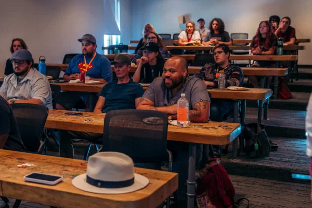 Students listening to a panel discussion