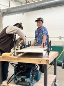 Professor Eric Mullis assisting a foundations student during fabrication.